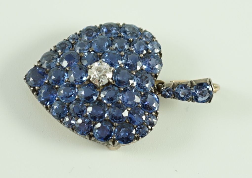 A late 19th/early 20th century gold and silver, sapphire and diamond heart shaped cluster pendant